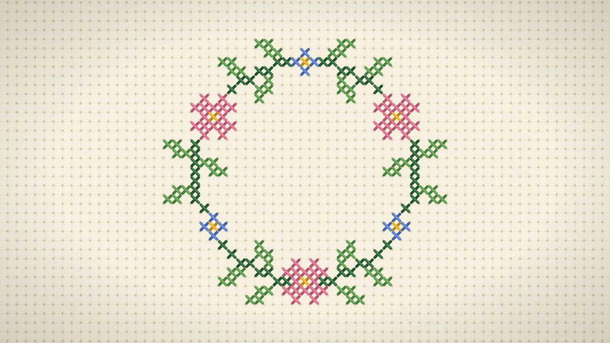 Stitched round wreath of green leaves, pink blossoms and small blue flowers with an empty center on cream Aida