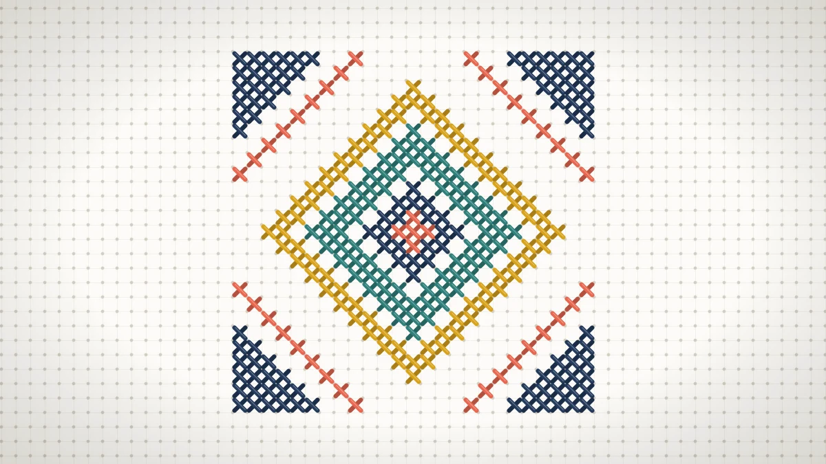 Stitched geometric cross stitch tile with nested coral, navy, teal and mustard diamonds on white Aida